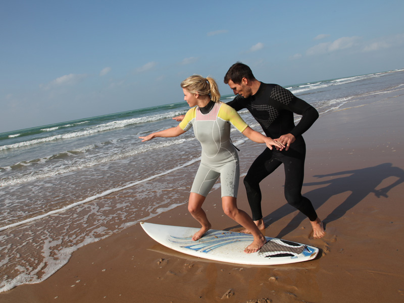 Beginner surfer getting tips.