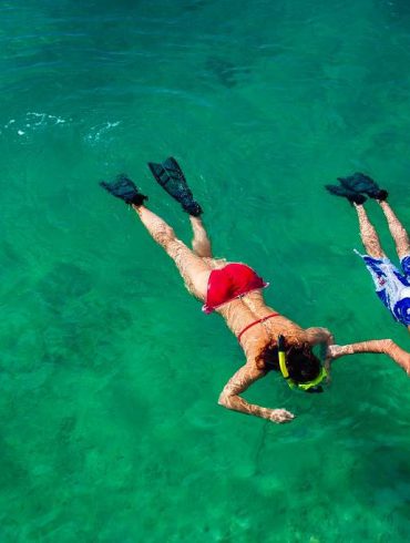 young couple snorkeling
