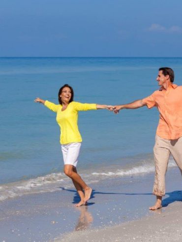 Couple celebrating on beach