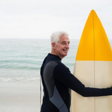 older guy with surfboard