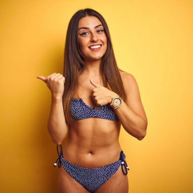 Physically fit young woman in bikini