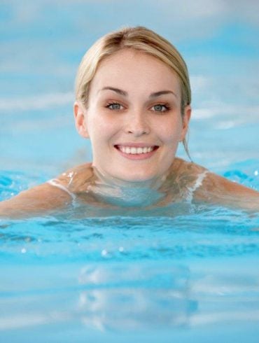 woman smiling in pool