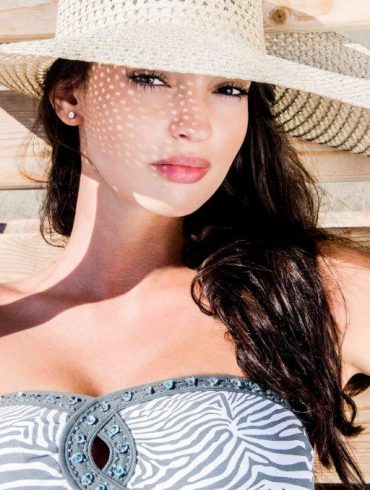 woman with hat on beach