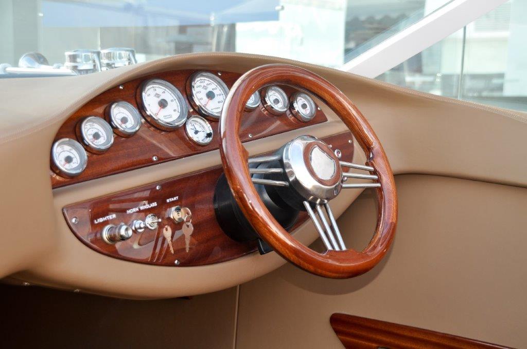 antique boat dashboard and steering wheel