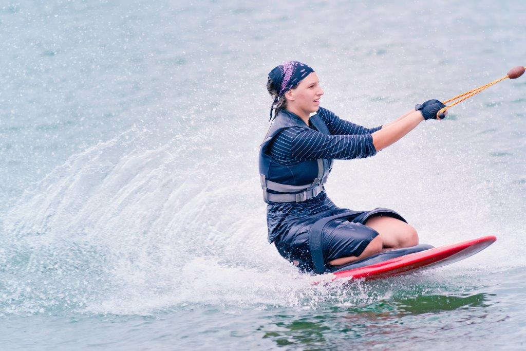 Woman kneeboarding