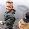Young boy learning to fish