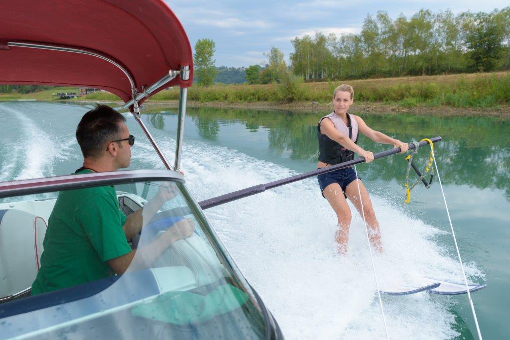 Practicing water skiing with bar in water