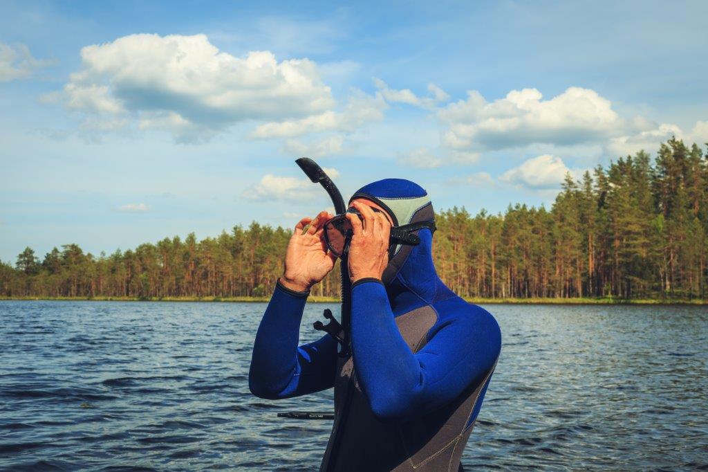 Man testing snorkel gear in ocean